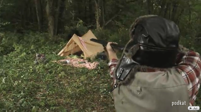 A hunter shoots a bear